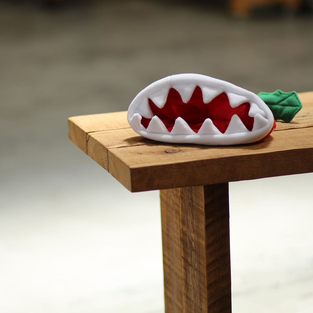 Official Nintendo product: Piranha Plant beanie (showing its jaws)